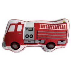 a pillow with a fire truck design on the front and back of it's face