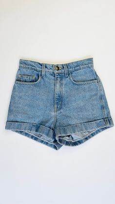 High rise denim shorts with fly front opening, 5 pockets and cuffed hem. 100% cotton. Waist: 13.5" Hips: 18" Rise: 12" Inseam: 2.5" Hem: 12.5" Medium Wash Cotton Jean Shorts, Light Wash Cotton Jean Shorts, Summer Medium Wash Jean Shorts With Rolled Hem, Spring Jean Shorts With Rolled Hem In Medium Wash, Summer Jeans With Rolled Hem In Medium Wash, Summer Denim Shorts With Rolled Hem, Cotton Cutoff Jean Shorts With Rolled Hem, High Waist Cotton Jean Shorts With Rolled Hem, Denim Jean Shorts With Rolled Hem For Summer