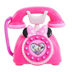 the minnie mouse phone is pink and has a heart on it's dial button