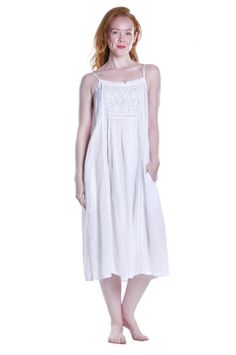 This unlined sleeveless dress from La Cera is beautifully styled with an embroidered detail bib yoke. It features two (2) side pockets and pleated details that continue down the bodice finishing this look of breathable cotton dress. This stylish nightgown is sure to add comfort and style to your wardrobe. Style: Nightg Sleeveless Floral Embroidery Midi Dress For Daywear, Sleeveless Midi Dress With Floral Embroidery For Daywear, Sleeveless Floral Embroidery Day Dress, Cotton Midi Dress With Slip Pockets, Cotton Midi Dress With Slip Pockets For Daywear, Cotton Midi Dress With Pockets For Daywear, Spring Cotton Sleeveless Dress With Lace Trim, Sleeveless Dresses With Smocked Bodice For Daywear, Embroidered Sleeveless Dress For Daywear