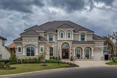 a large house with many windows on the front