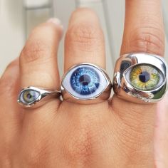 Evil Eye Signet Rings. These beautiful rings are quite a statement. If you love different unique jewelry, you can choose from any of these three sizes!. Chunky and heavy in all material versions. These eye rings are made to order in different materials: .925 sterling silver SGP (Silver gold plated) Solid 18k gold (yellow or white) in just the medium model. If you would like a gold version of any of the other two let me know so I can give you a quote. For a small additional fee, we also offer the Mystical Internally Threaded Jewelry As Gift, Mystical Internally Threaded Jewelry For Gift, Mystical Internally Threaded Jewelry For Gifts, Unique Eye-shaped Jewelry For Gifts, Prosthetic Eye, Whimsical Gothic, Eye Rings, Signet Rings, Evil Eye Ring