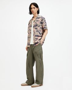 We're looking back. The Verge Pants are inspired by vintage cargo pants. Carefully crafted with an organic cotton fabric, the silhouette is wide in the leg and relaxed fitting. Complete with angled patch on the side and a further five throughout the trouser, they keep things authentic. Laidback styling, sorted.  Button fly closure Wide straight leg Mid-rise Vintage-inspired Angled side patch pockets Front welt pockets Back flap pockets Regular length Spring Military Style Cotton Cargo Jeans, Military Style Relaxed Fit Wide Leg Parachute Pants, Khaki Wide-leg Cargo Jeans With Patch Pockets, Military Wide Leg Cotton Cargo Jeans, Khaki Wide Leg Cargo Jeans With Patch Pockets, Wide Leg Khaki Cargo Jeans With Patch Pockets, Relaxed Fit Wide Leg Military Cargo Jeans, Urban Cotton Parachute Pants With Flap Pockets, Khaki Cotton Parachute Pants With Flap Pockets