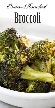 broccoli in a white bowl on a table with the title overlay reads, oven roasted broccoli