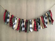 a plaid and burlap banner hanging on a wall