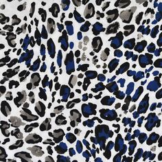 an animal print with blue and black spots