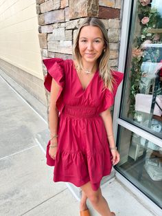 Elevate your game day style with our In The Stands Ruffle Poplin Dress. This V-neckline dress features poplin ruffle sleeves, a smocked waist, and a tiered ruffle hem for a feminine touch. With a concealed back zipper, it's the perfect combination of comfort and chic! Ruffle Sleeve Smocked Waist Concealed Back Zipper Ashlyn is wearing a small in this dress which is her true size. Pretty In Pink Dress, Casual Work Wear, Pink Pineapple, Casual Date Night, School Season, Neckline Dress, Poplin Dress, Next Clothes, Necklines For Dresses