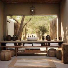 a bathroom with a wooden table and stools