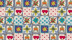 a colorful tile pattern with hearts and flowers