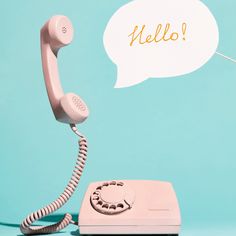 an old phone with a speech bubble above it that says hello on a blue background