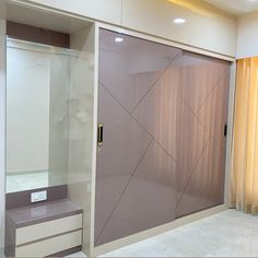 a bathroom with a sliding glass shower door