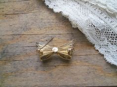 "Delicate antique 800 silver, two tone gold washed and bright silver filigree bow brooch. Highly detailed, three dimensional, very good condition, no broken or missing pieces, safety c pin back works well, holds securely. Measures 1 3/4\" x 7/8\". **Shipping includes insurance, when available**" Vintage Jewelry With Decorative Bow As Gift, Vintage Wedding Brooch With Bow Detail, Vintage Wedding Brooch With Bow, Vintage Wedding Brooches With Bow Detail, Vintage Wedding Jewelry With Bow Detail, Vintage Wedding Brooches With Bow, Vintage Gold Jewelry With Ribbon, Vintage Ribbon Brooches As Gift, Gold Ribbon Brooches As Gift