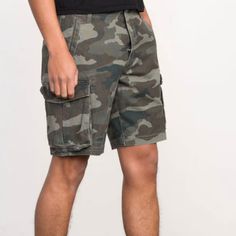 Elevate Your Casual Style With These Levi's Men's Carrier Cargo Shorts. These Shorts Are Perfect For Any Casual Occasion And Are Crafted With High-Quality Cotton Material That Ensures Maximum Comfort. The Multicolor Camo Pattern Will Add A Pop Of Color To Your Outfit, While The Button And Zipper Accents Along With The Cargo Pockets Create A Stylish And Functional Look. These Shorts Hit At The Knee And Are Loose Through The Thigh For A Relaxed Fit. The Front Is Designed With A Flat Front And Feat Military Style Short Bottoms With Pockets, Military Style Short Bottoms With Side Pockets, Military Style Shorts With Pockets, Military Style Shorts With Side Pockets, Levi's Casual Bottoms With Cargo Pockets, Casual Levi's Bottoms With Cargo Pockets, Camouflage Shorts With Pockets, Military Style Short Bottoms For Streetwear, Camouflage Short Bottoms With Pockets