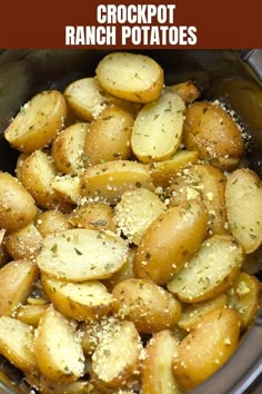 crockpot ranch potatoes in a slow cooker with seasoning sprinkled on top