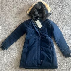 Nwt Canada Goose Lorette Parka In Atlantic Navy In A Size S! Definitely Fits More Like A S-M! (Have Other Sizes As Well) Comes With The Fur Trim Which Is Now Discontinued! Feel Free To Check My Sold Listings For Previous Jacket Sale Reviews! Retails $1775! Navy Long Sleeve Outerwear, Jacket Sale, Fur Trim, Canada Goose, Canada Goose Jackets, Parka, Jackets For Women, Jackets & Coats, Trim