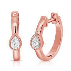 rose gold hoop earrings with pear shaped diamonds on the front and back ends, set against a white background