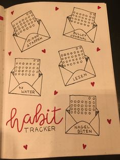 an open notebook with some drawings on it and the words habit tracker written in red ink