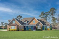 a large house in the middle of a green field