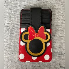 Nwot Disney This Authentic Disney Design Makes This Stacked Credit Card Holder One That Will Brighten Every Day. Fashioned In Faux Leather, It Features A Minnie Mouse Snap To Keep Your Cards Safe, Plus Window Id Holder. 4 Card Slots And 1 Id Window Securing Snap Fastener Window Id Slot Contrast Stitching 5'' H X 3 1/4'' W Imported *Authentic Disney Park Merchandise- I Bought It At Magic Kingdom And Never Used It* Disney Bags, Disney Designs, Disney Park, Snap Fasteners, Id Holder, Credit Card Holder, Magic Kingdom, Contrast Stitch, Card Slots