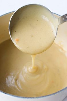 a ladle full of batter being poured into a bowl