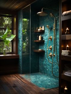 a walk in shower sitting next to a window with candles on the shelves above it