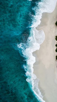 an aerial view of the beach and ocean