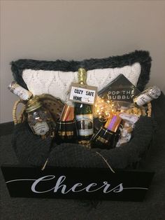 a basket filled with wine and other items