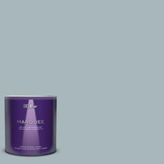 a can of hair color on a blue background with the words marquee written below it