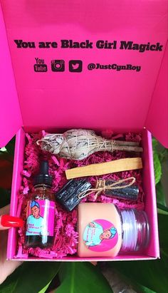 a pink box filled with lots of different items