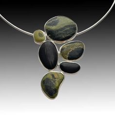 Beachstone Pendant Modern Polished Finish Necklace, Modern Green Necklace With Polished Finish, Contemporary Pendant Necklace For Formal Occasions, Contemporary Formal Pendant Necklace, Modern Round Natural Stone Necklaces, Modern Round Jewelry With Large Stone, Contemporary Oval Jewelry With Polished Finish, Modern Jewelry With Large Round Stone, Contemporary Round Sterling Silver Necklaces