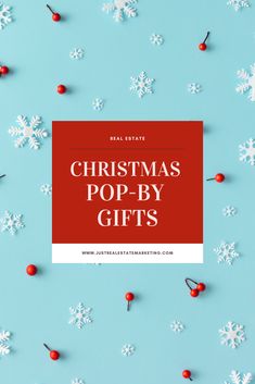 christmas pop - by gifts on a blue background with white snowflakes and red berries