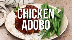 chicken adobo on a plate with rice and green beans