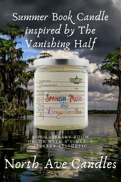 a jar of candles sitting on top of a body of water with the words, summer book candle inspired by the vanishing half