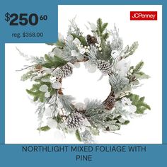 a christmas wreath with pine cones and snowflakes is on sale for $ 250 00