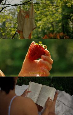 a woman reading a book while holding a strawberry