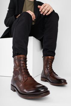 This exquisite handmade boot is the contemporary incarnation of artisanal craftsmanship. The finest full-grain buffalo skin is hand-dyed a beautiful shade of reddish brown, stonewashed and vigorously brushed. The upper is Blake-stitched onto a hand-built buffalo leather outsole. Ideal for the gentleman traveller and the city dweller, this boot adds a distinctive rock&roll touch to any attire. Most customers size down one full size. The urban-black and timber-brown versions of this style feature Shoe Bags For Travel, Mid Heel Boots, Low Heel Boots, Handmade Boot, The Gentleman, Military Boots, Urban Looks, Buffalo Leather, Reddish Brown