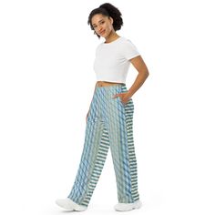 Get the comfort of pajamas in this stylish pair of wide-leg pants. With the adjustable waist and stretchy fabric, it’s like your favorite sweatpants but better. • Relaxed unisex fit • Practical side pockets • Elastic waistband with a white drawstring • Can be worn on the waist or on the hips • Premium knit mid-weight jersey fabric • 95% polyester, 5% elastane (fabric composition may vary by 1%) • Fabric weight: 6.19 oz/yd2 (210 g/m2) (weight may vary by 5%) This product is made especially for yo Turquoise Wide Leg Bottoms For Spring, Turquoise Wide-leg Bottoms For Spring, Casual Fitted Turquoise Pants, Fitted Turquoise Casual Pants, Trendy Blue Full Length Wide Leg Pants, Casual Turquoise Wide Leg Bottoms, Fitted Wide Leg Blue Harem Pants, Blue Fitted Wide Leg Harem Pants, Style Wide Leg Pants