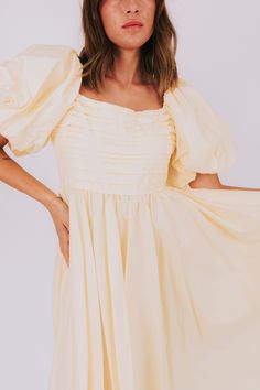 Have a slice of sweet style with our Lemon Meringue Dress! This dress will make you feel like a summer treat with its puffy sleeves, pleated bust, and square neckline. Perfect for sunny days and fun nights! Details Puffy sleeves Pleated bust Square neckline Lined to the knee Sizing Approximate measurements: SIZE LENGTH BUST Small 46" 36" Medium 47" 38" Large 50" 40" Fabric has no stretchModel is 5’8 wearing small Material Self 100% CottonLining 100% PolyesterHand wash coldHang to dry Puff Sleeve Ruffle Dress For Day Out, Puff Sleeve Pleated Mini Dress For Brunch, Brunch Mini Dress With Puff Sleeves And Pleated Details, Ruched Puff Sleeve Mini Dress For Garden Party, Summer Ruched Puff Sleeve Brunch Dress, Summer Puff Sleeve Dress With Ruffles, Summer Puff Sleeve Mini Dress With Gathered Neckline, Ruched Puff Sleeve Dress For Summer Brunch, Summer Mini Dress With Puff Sleeves And Gathered Neckline