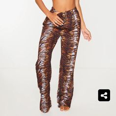 Brown Zebra Print Beach Pants Stretch Tiger Print Bottoms, Trendy Fitted Tiger Print Bottoms, Fitted Tiger Print Trendy Bottoms, Chic Brown Beach Pants, Chic Brown Pants For Beach, Fitted Tiger Print Bottoms, Trendy Brown Summer Pants, Summer Party Pants In Brown, Summer Party Brown Pants