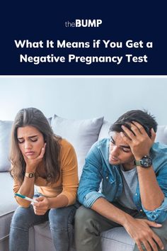 two people sitting on a couch with the text what it means if you get a negative pregnancy test