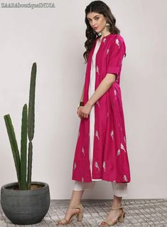 HAND CRAFTED KURTA SET DESCRIPTION *Fuchsia and white printed kurta with trousers *Fuchsia layered straight calf length kurta, has a mandarin collar, three-quarter sleeves, flared hem White solid trousers, drawstring closure *Fabric:- Top fabric: Pure Cotton Bottom fabric: Pure Cotton *Wash Care:- Hand-wash AVAILABLE IN 5 SIZES THEY ARE IN FOLLOWING MEASUREMENTS IN INCHES:- S:- Bust-36/Shoulder-14.5/Top Length-47/Bottom Waist-32/Bottom Length-37/Hip-40 M:- Bust-38/Shoulder-15/Top Length-47/Botto Indian Dress For Women, Shaurya Sanadhya, Ethnic Jacket, Women Ethnic Wear, Indian Dresses For Women, Green Lehenga, Indian Dress, Ethnic Dress, Indian Outfit