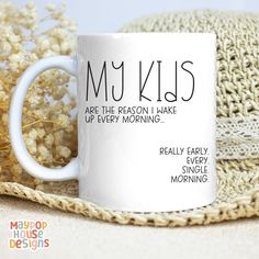 a white coffee mug with the words my kids are the reason i make of every morning