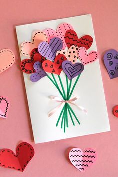 valentine's day card with paper hearts and flowers