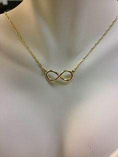 Express your never-ending love with this beautiful infinity pendant. Crafted in warm 14K yellow gold, this infinity symbol-shaped design is attached Gold Infinity Necklace For Anniversary Gift, Infinity Jewelry For Mother's Day, Gold Infinity Necklace For Anniversary, Gold Infinity Jewelry For Anniversary, Gold Infinity Jewelry For Mother's Day, Gold Infinity Necklace, Infinity Necklace Gold, Jewelry Gold Necklace, Jewelry Fancy