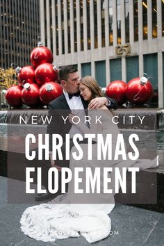 a man and woman are hugging in front of christmas decorations with the words new york city christmas