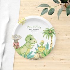 a paper plate with an image of dinosaurs on it