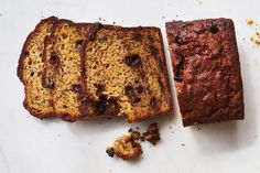 two slices of banana bread sitting on top of a white counter next to each other