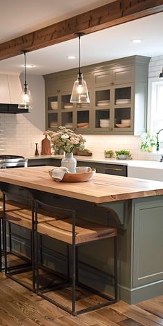 a kitchen with an island and two stools