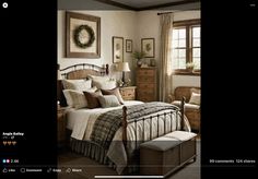 a bed room with a neatly made bed next to a window and a wreath on the wall