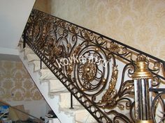 an iron stair rail with decorative designs on it